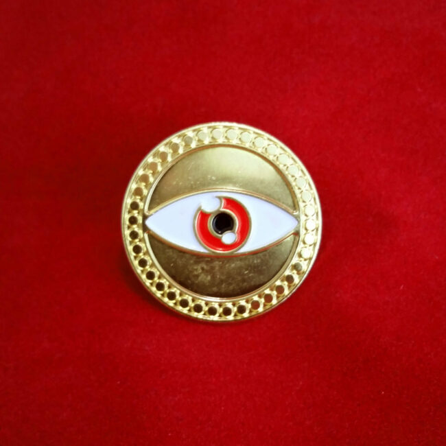 Doctor Strange Eye of Agamotto pin on red background